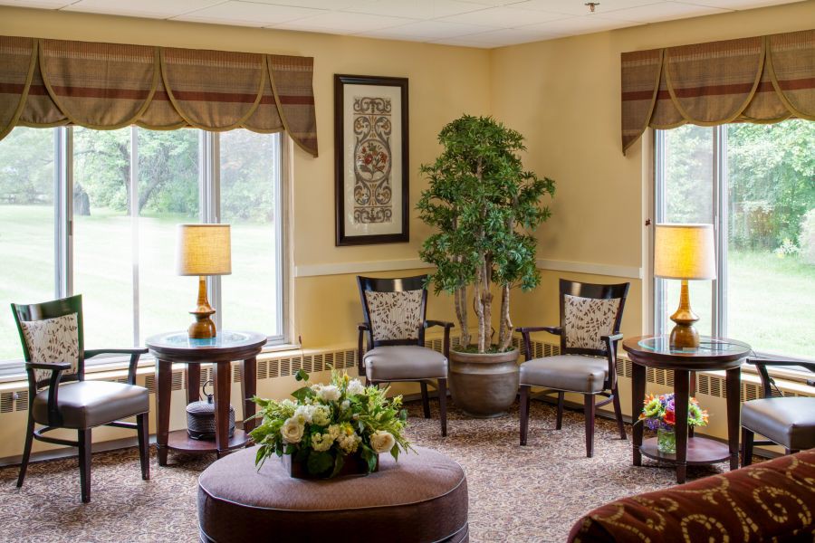 A cozy living room with elegant furniture and warm lighting.