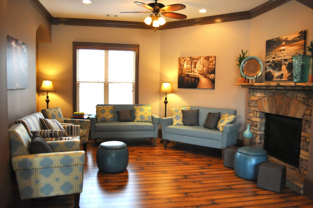A cozy living room with modern furnishings and warm lighting.