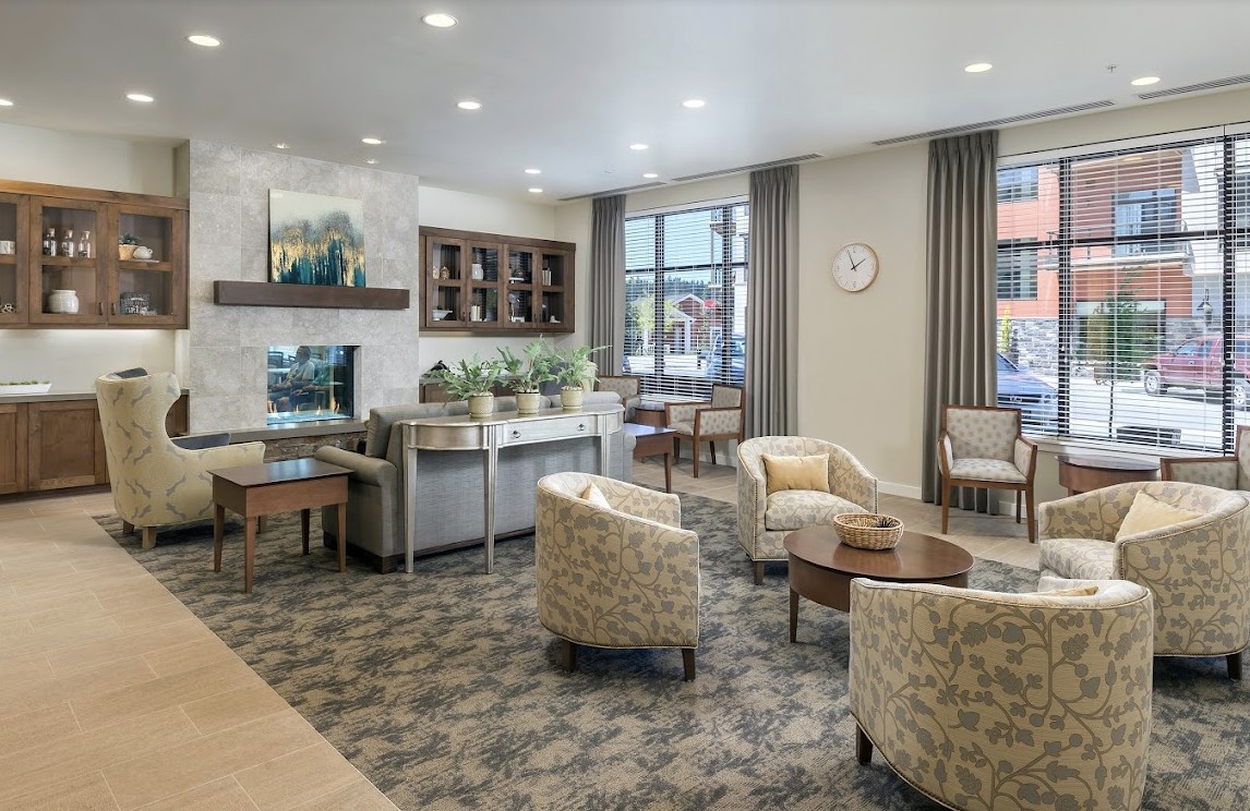 A modern waiting area featuring comfortable seating and stylish decor.