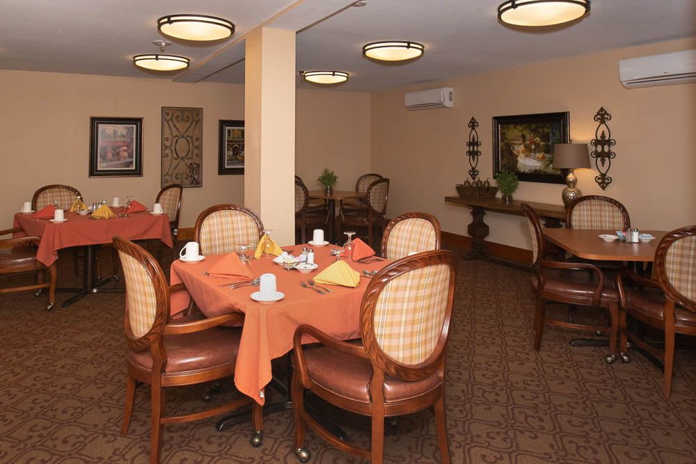 A cozy dining room with neatly arranged tables and elegant decor.
