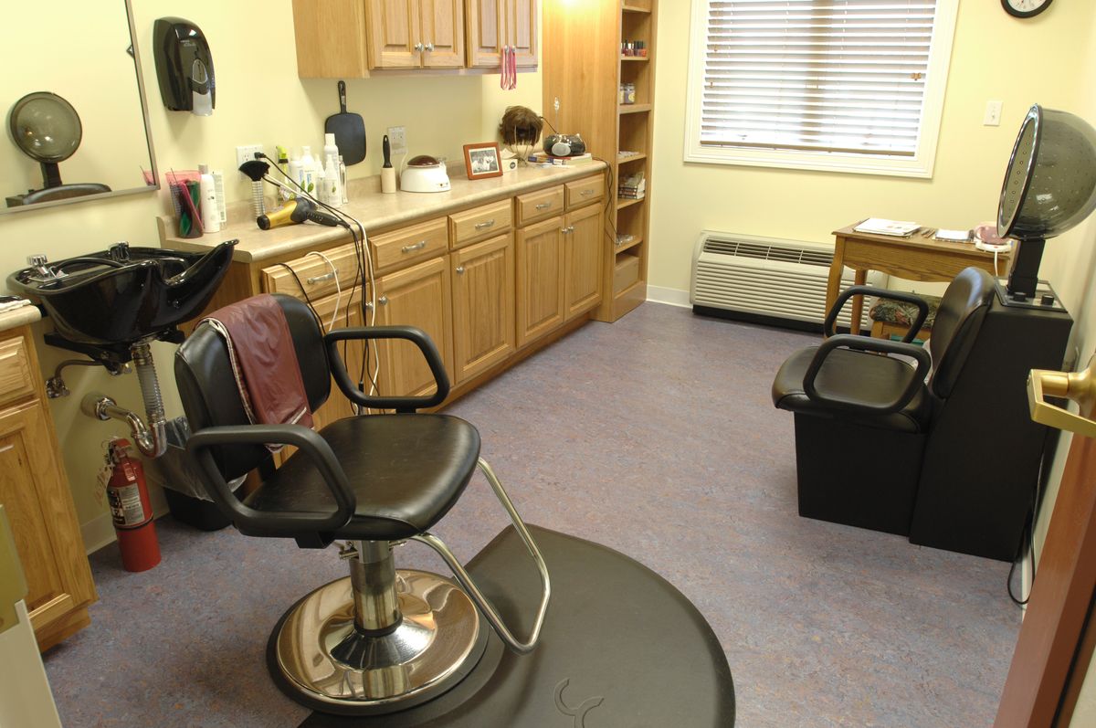 A well-organized hair salon with chairs and styling equipment.