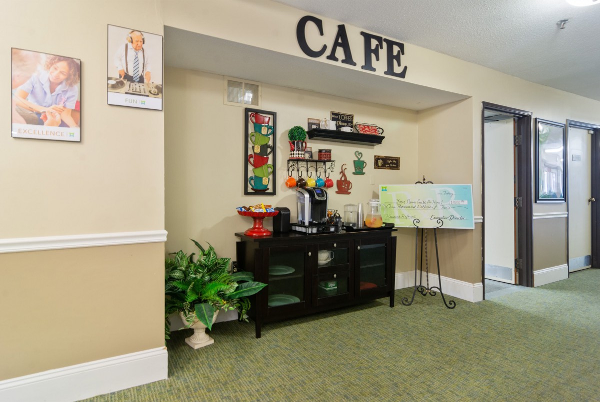 A cozy cafe setup with a coffee station, decorative elements, and a welcoming atmosphere.