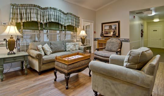 A cozy living room with comfortable seating and classic decor.