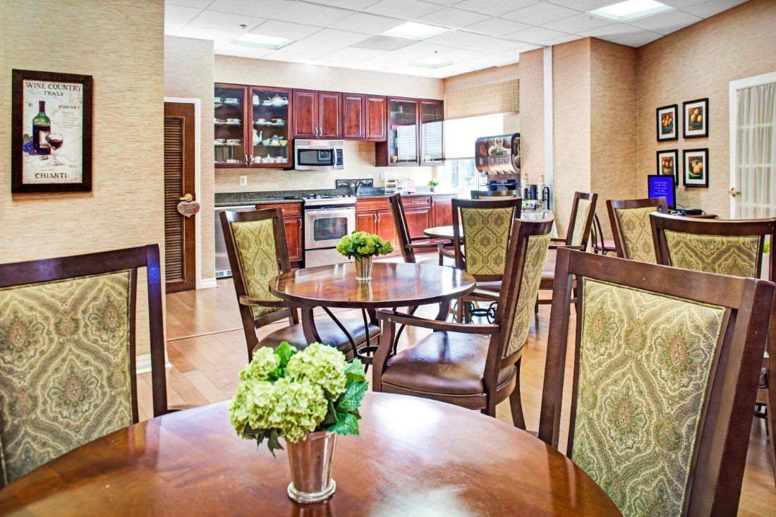 A modern kitchen and dining area with wooden furniture and elegant decor.