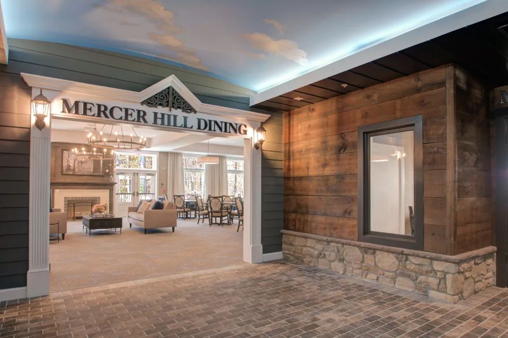 The elegant lobby entrance features a chandelier and comfortable seating area.
