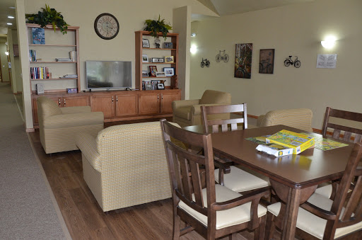 A cozy living space featuring a comfortable seating area and a dining table.