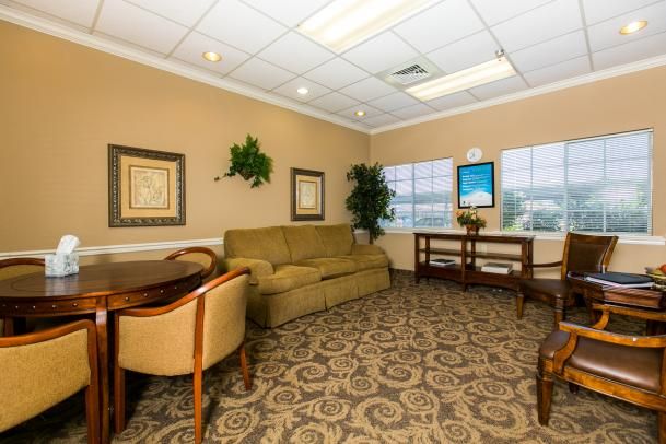 A comfortable waiting room with stylish furniture and decor.