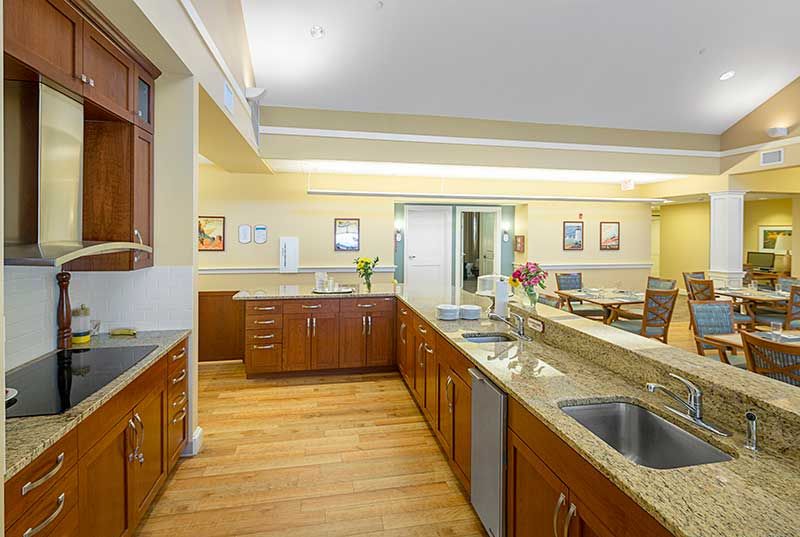Spacious kitchen with wooden cabinets and modern appliances.