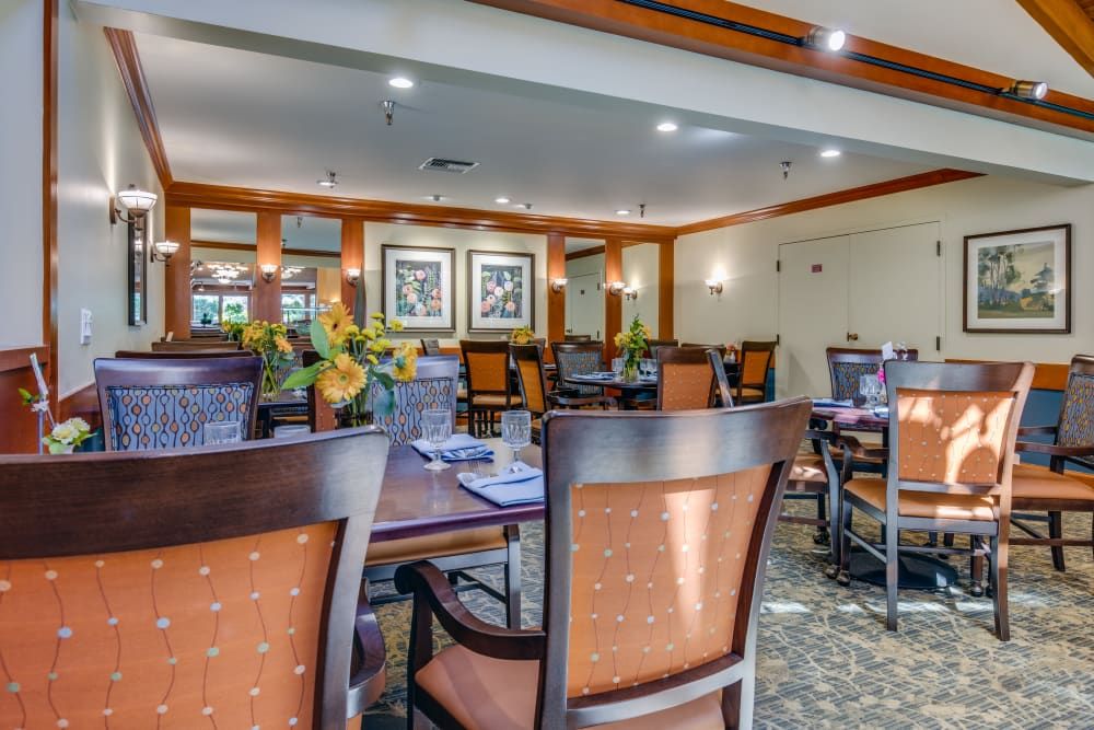 A well-decorated dining room with elegant furniture and ambient lighting.