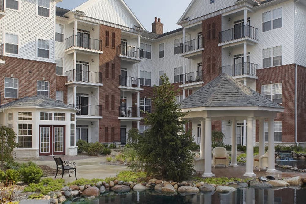 A modern apartment complex featuring balconies and landscaped outdoor areas.
