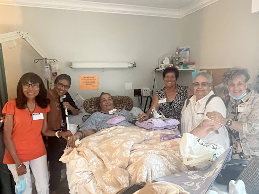 A group of family members visiting a loved one in the hospital, offering support and companionship.