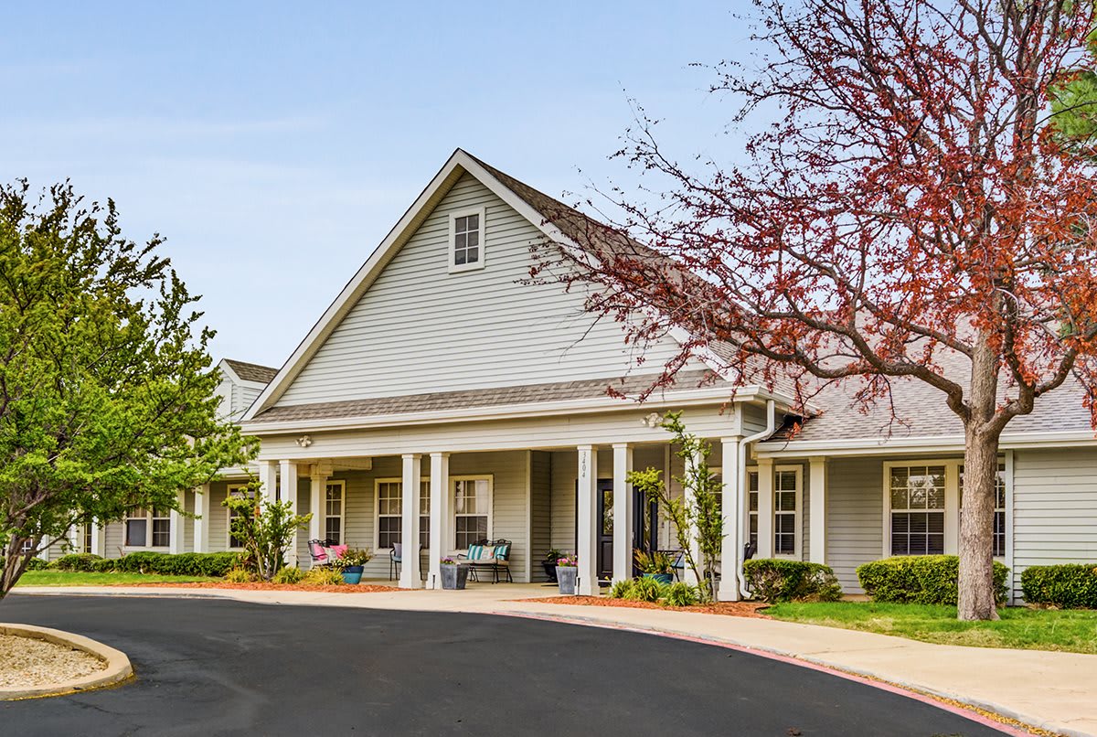 A residential building with a well-maintained exterior and landscaped surroundings.