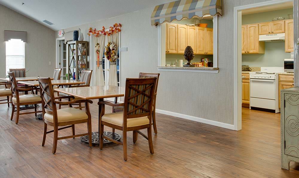 A cozy dining area with wooden furniture and decorative elements.