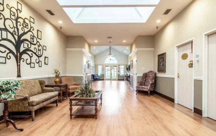 A spacious lobby area with comfortable seating and a skylight.