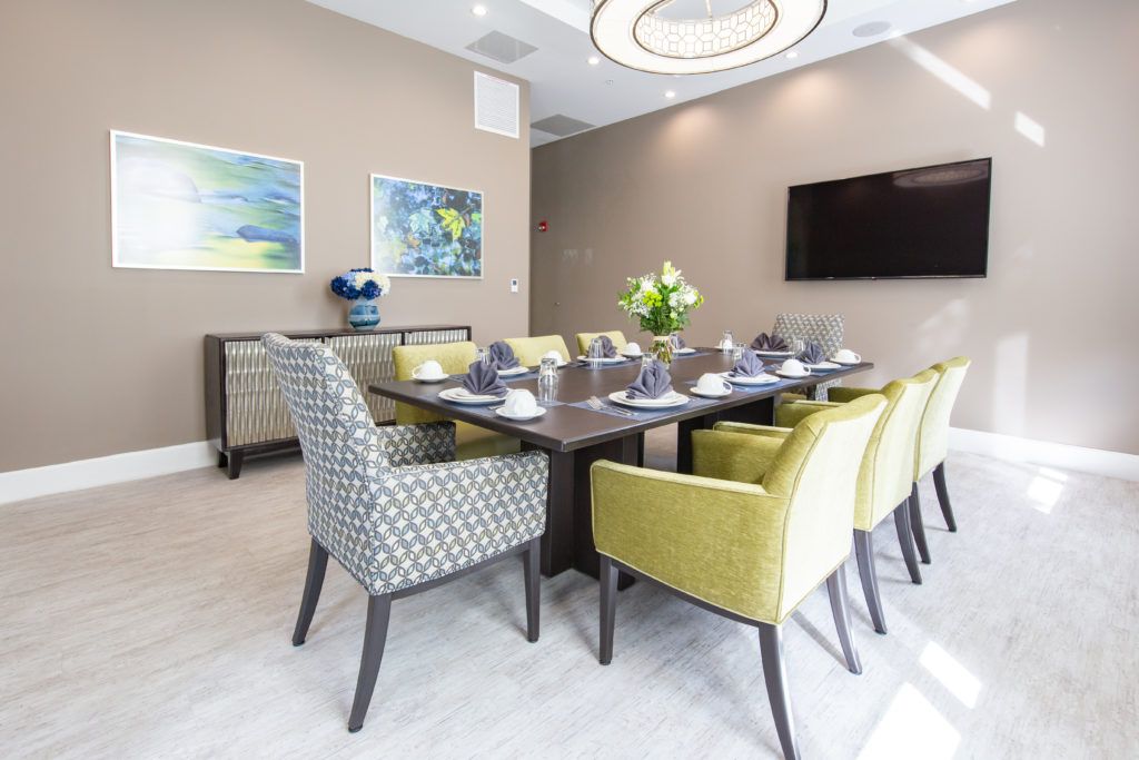 A modern dining room with a contemporary table setting and stylish furniture.