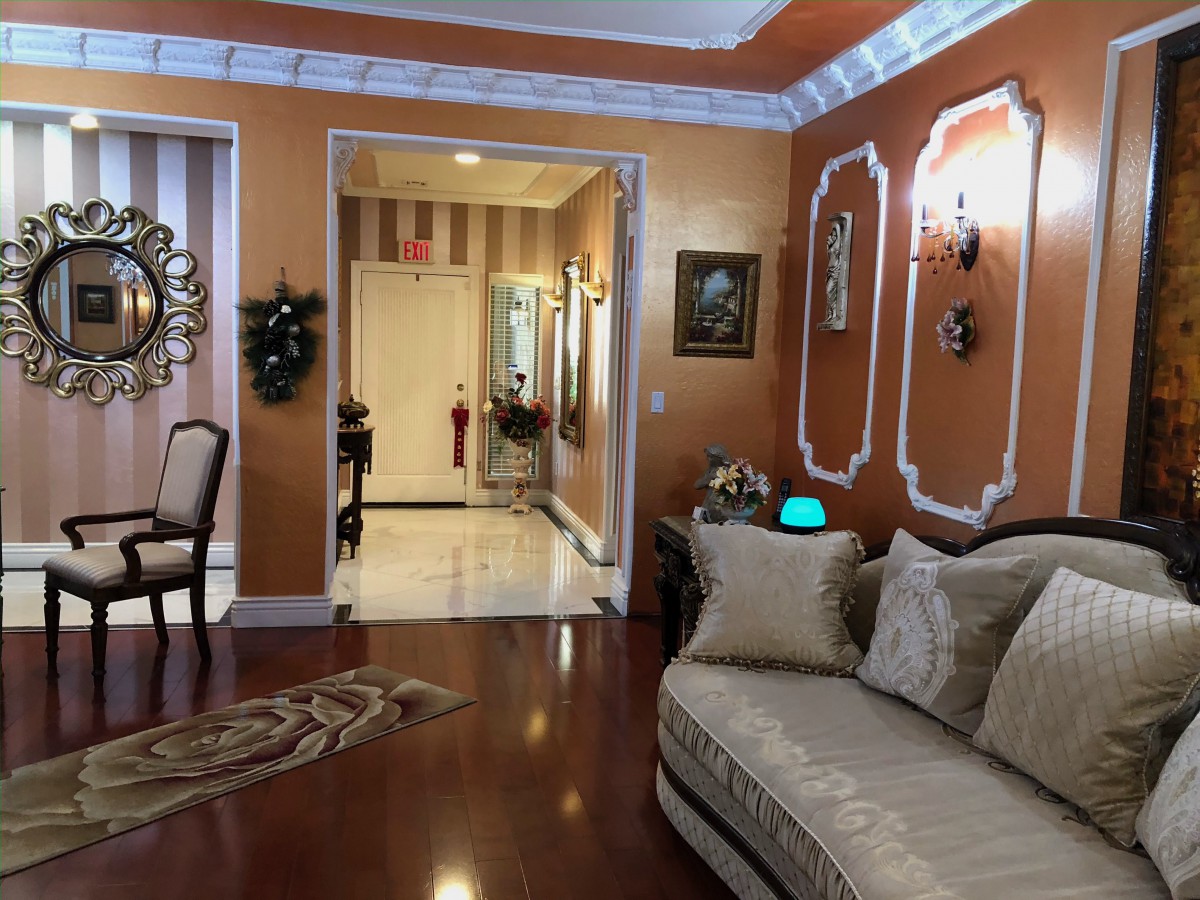 A luxurious living room with elegant decor and hardwood flooring.