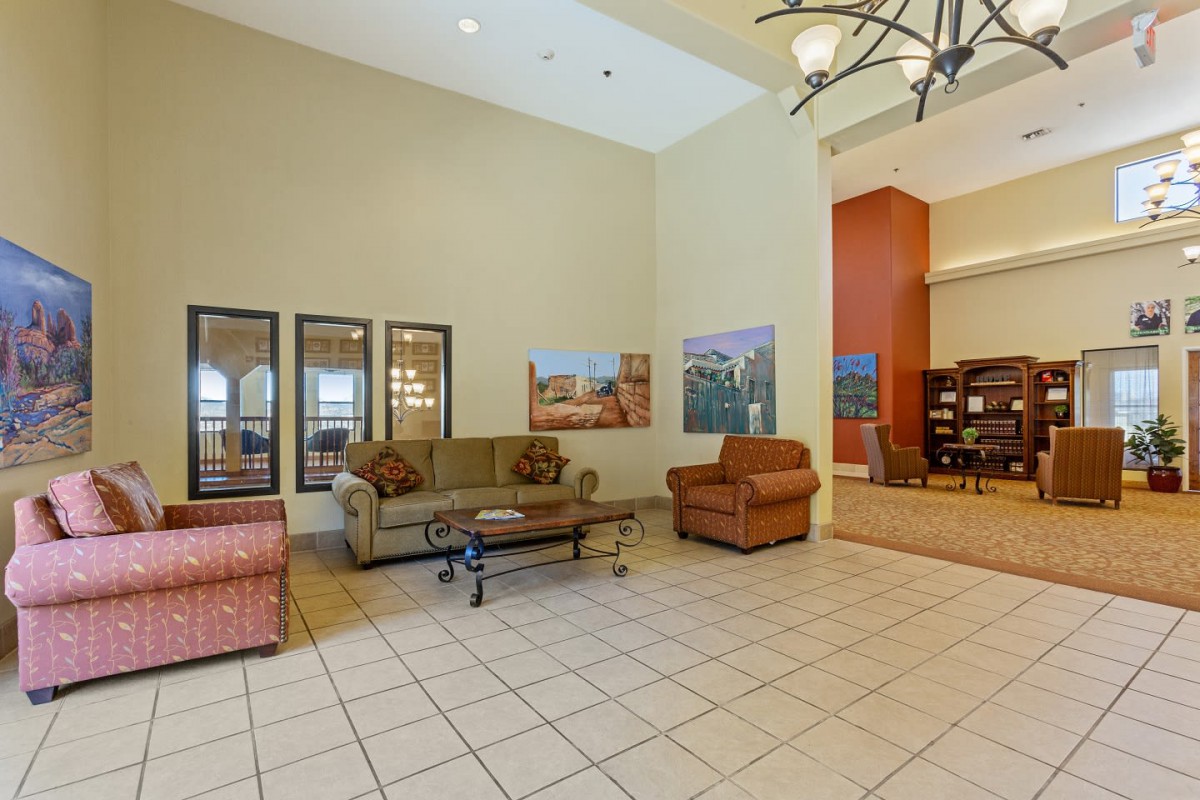 Spacious lobby with comfortable seating and decor.