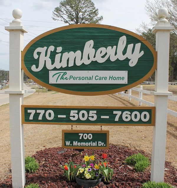 Sign for Kimberly Personal Care Home with contact details.