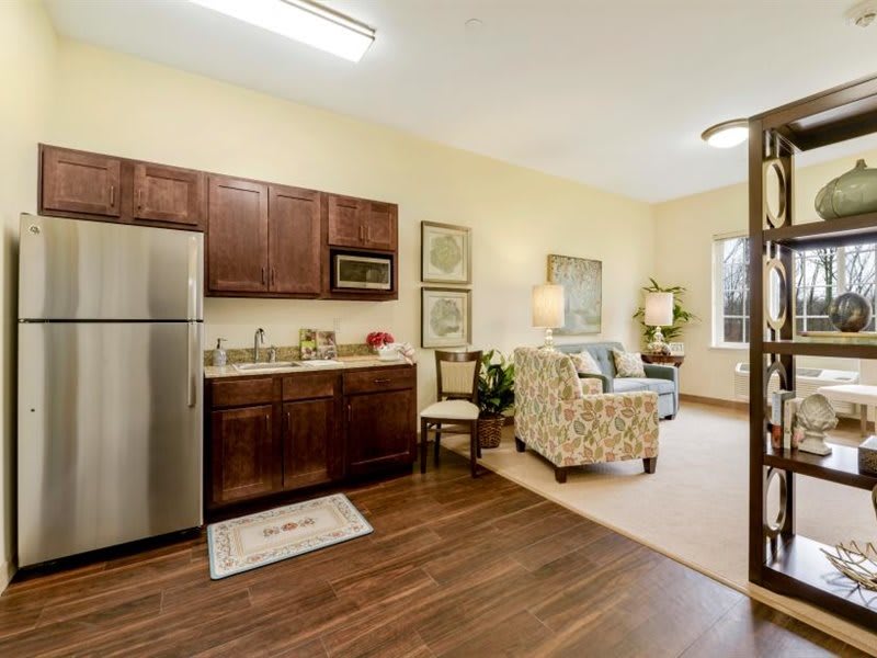 A cozy open-concept apartment with a kitchen and living area.