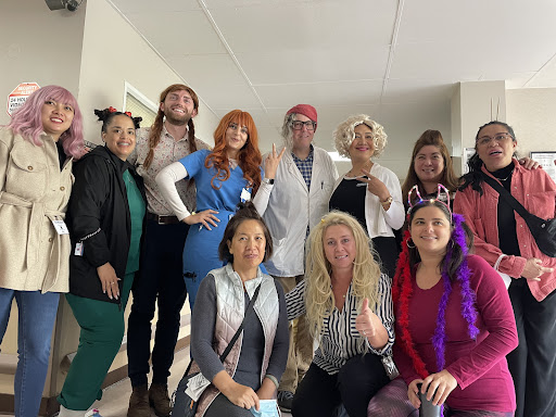 A lively group dressed in a variety of fun costumes, showcasing creativity and celebration.