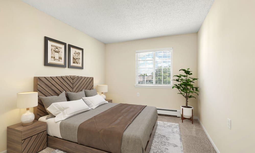 A cozy bedroom with a neatly made bed, artwork on the walls, and a plant by the window.