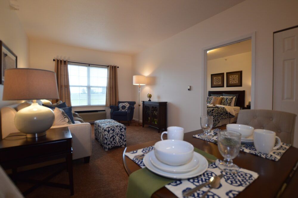 A cozy living and dining area featuring stylish furniture and soft lighting.