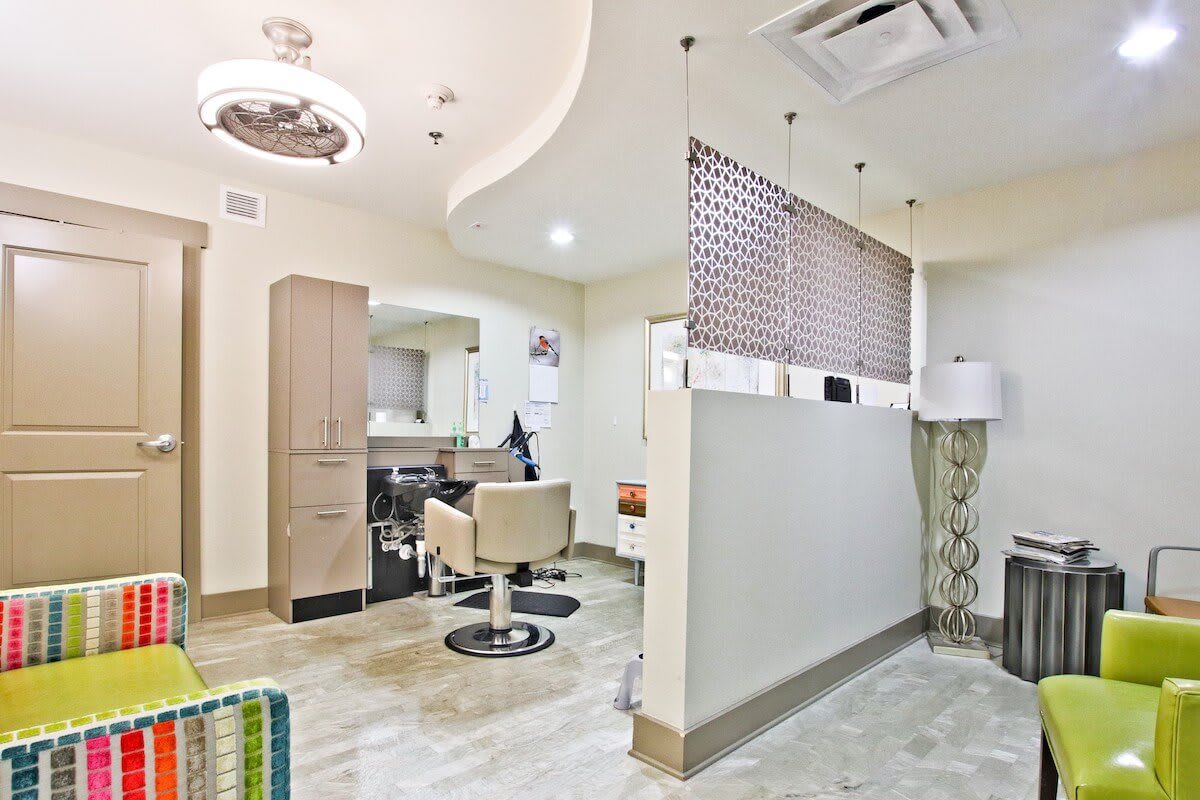 A modern and stylish beauty salon interior with hairdressing stations.