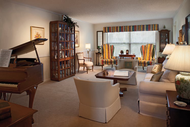 A cozy living room with elegant furniture and warm lighting.