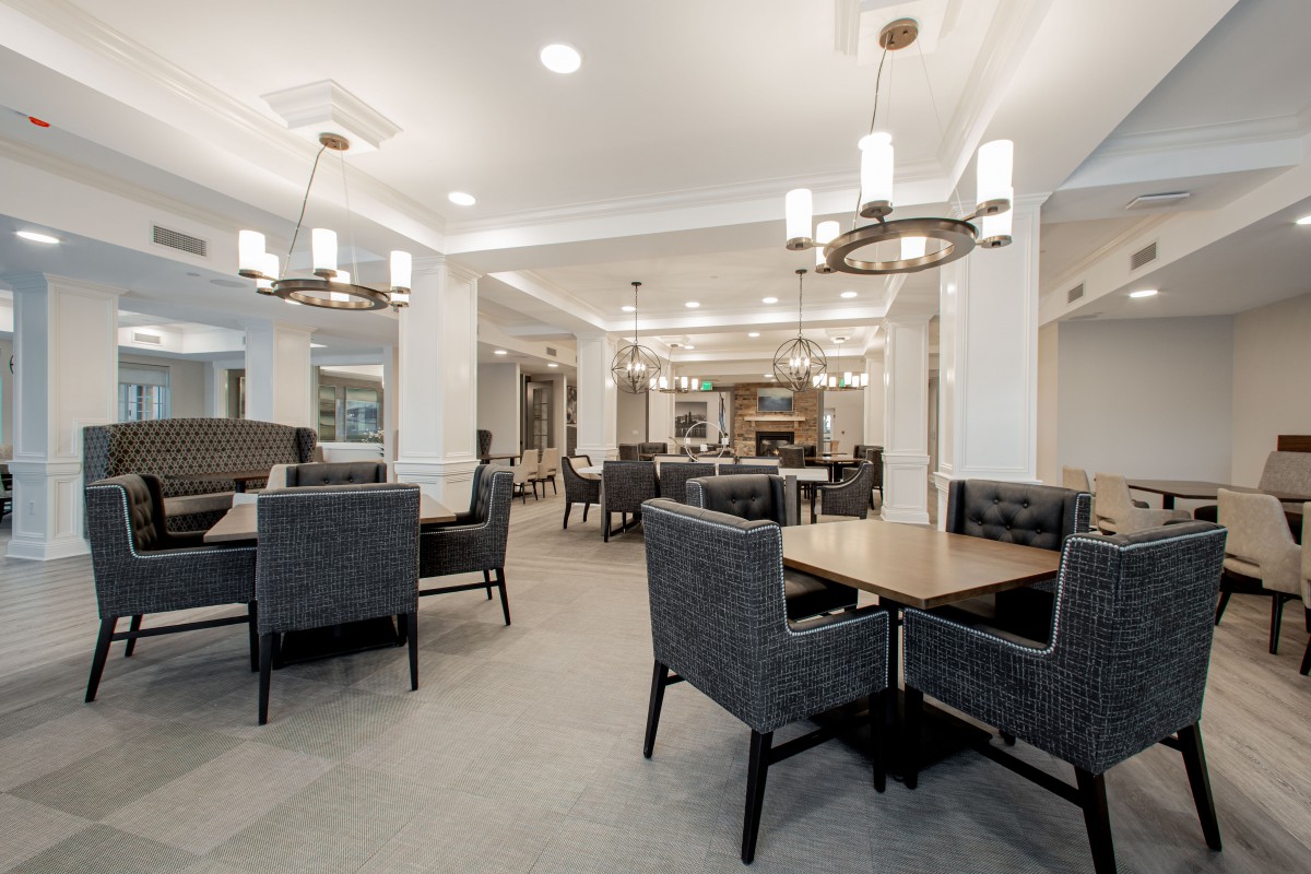 A modern dining area with stylish lighting and comfortable seating.