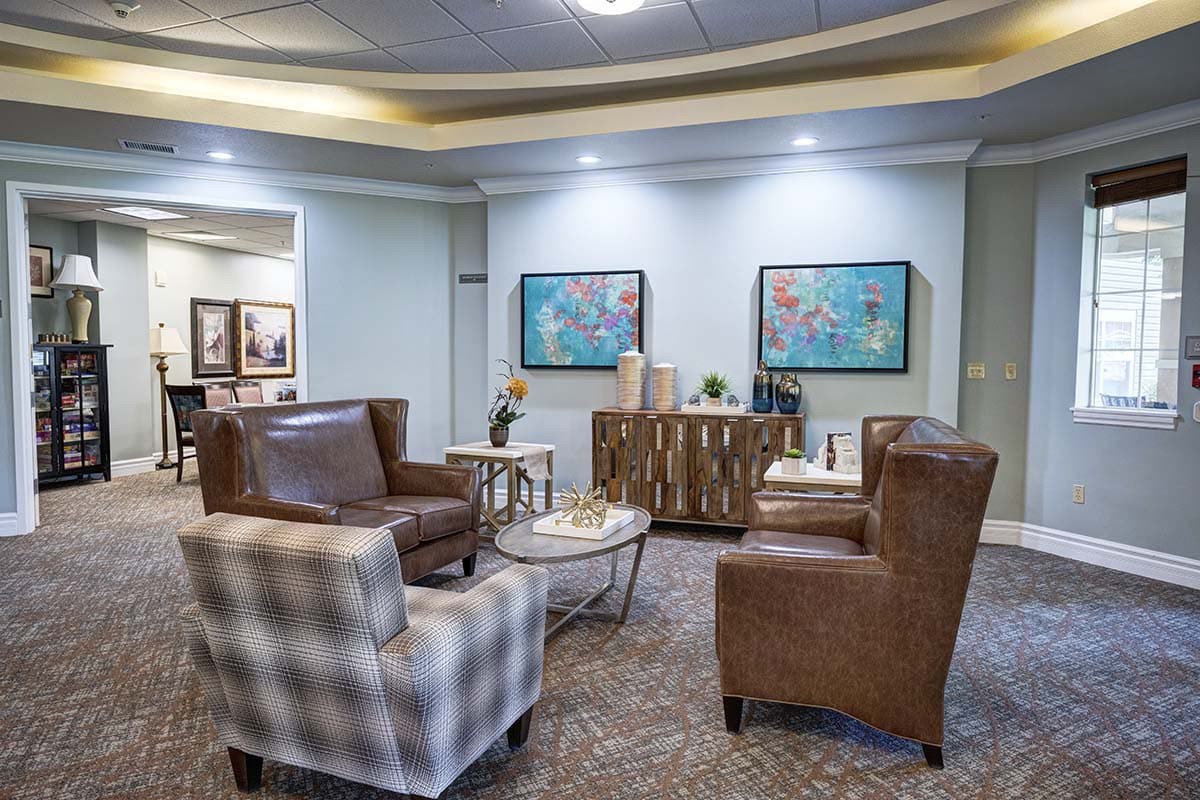 A modern living room with comfortable seating and decorative artwork.