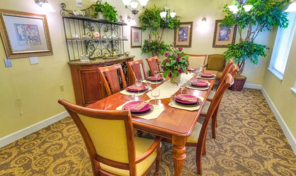 A well-decorated dining room with a set table and elegant decor.