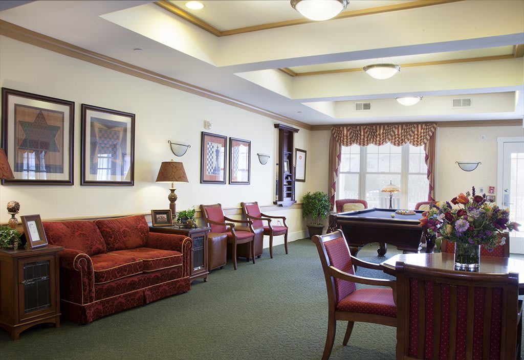 A cozy lobby area with comfortable seating and warm decor.