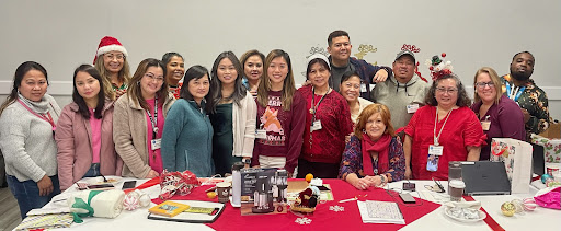 A joyful gathering of friends and community members celebrating together with crafts and smiles.
