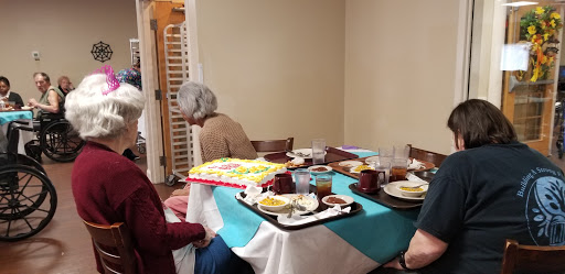 A cozy gathering around a table filled with delicious food.