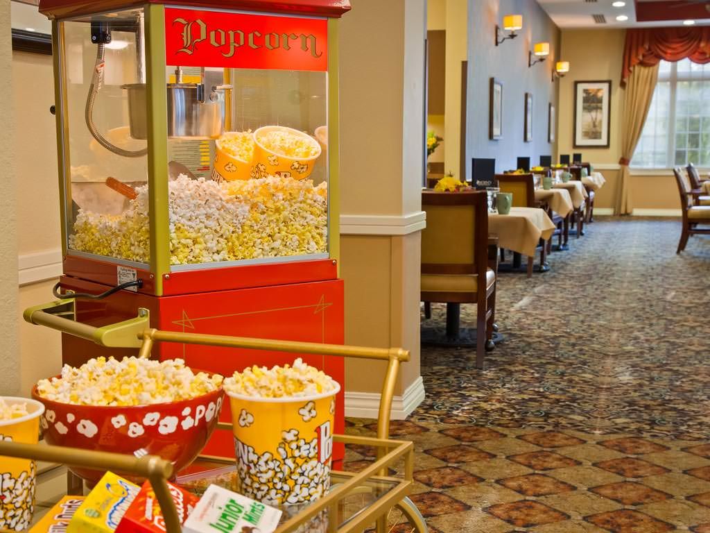 A popcorn machine in a cozy hallway offering fresh snacks.