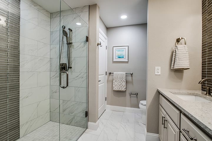 Modern bathroom with a glass-enclosed shower and stylish fixtures.