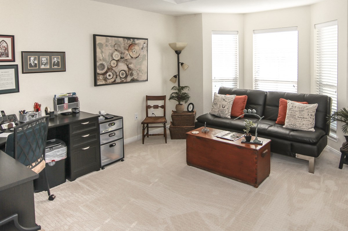 A cozy living room with modern decor and furniture.
