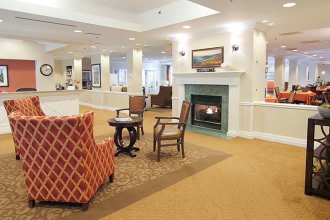 A cozy lobby area with comfortable seating and a fireplace.