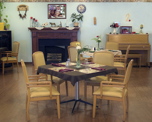 A cozy dining area with neatly arranged tables and warm decor.