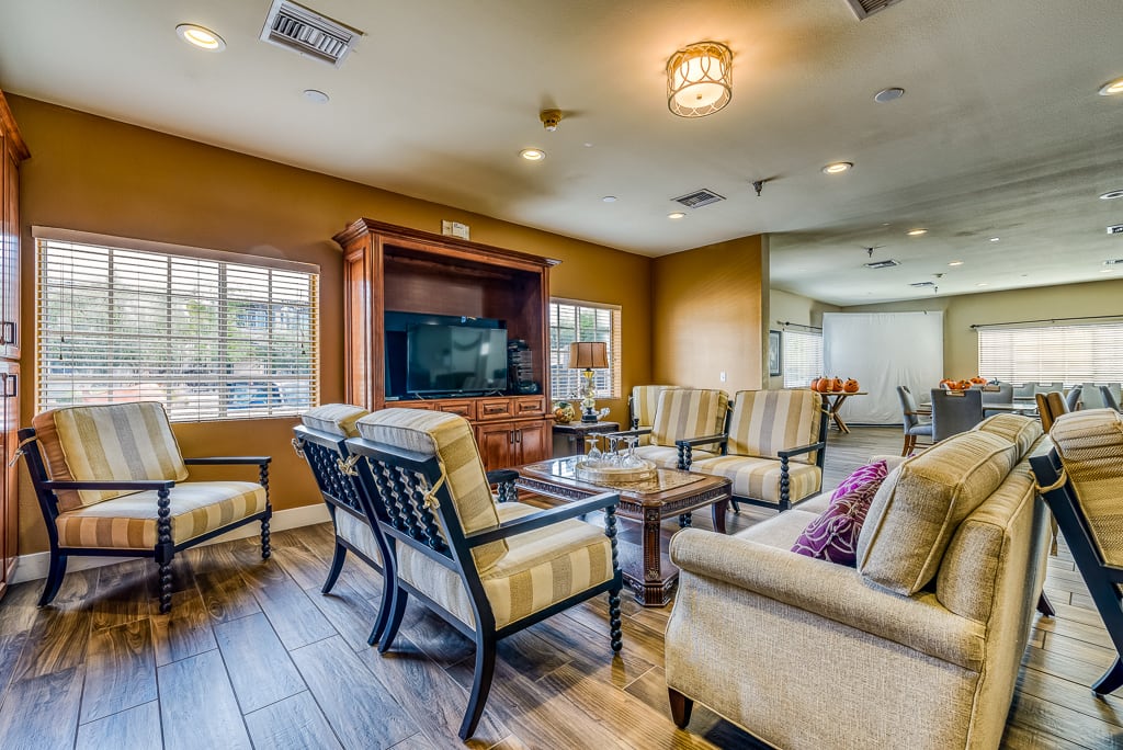 A cozy living room with comfortable seating and a television.