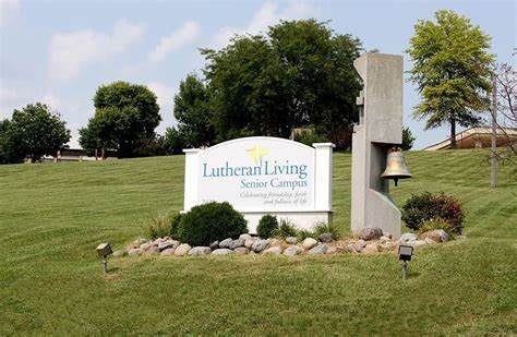 Lutheran Living Senior Campus sign in a landscaped outdoor setting.