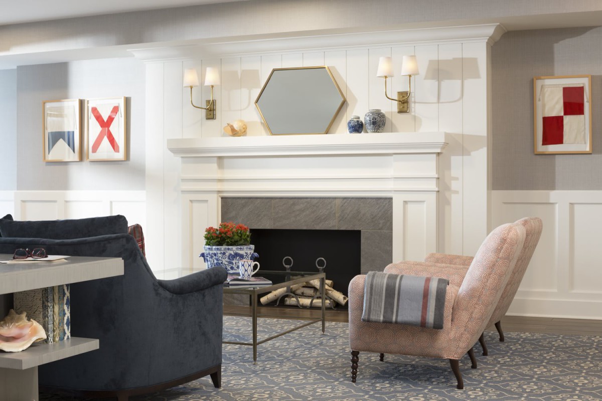 A cozy living room with a stylish fireplace and comfortable seating.