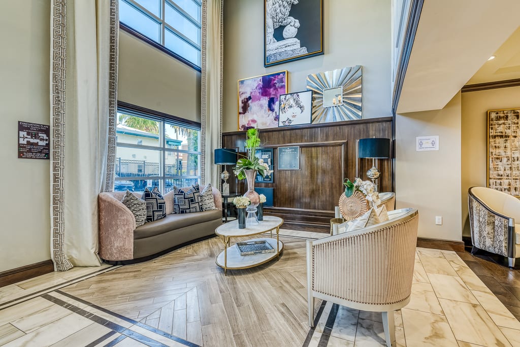 A modern living room with contemporary furniture and artistic wall dcor.