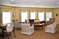 A cozy living room with comfortable seating and natural lighting.