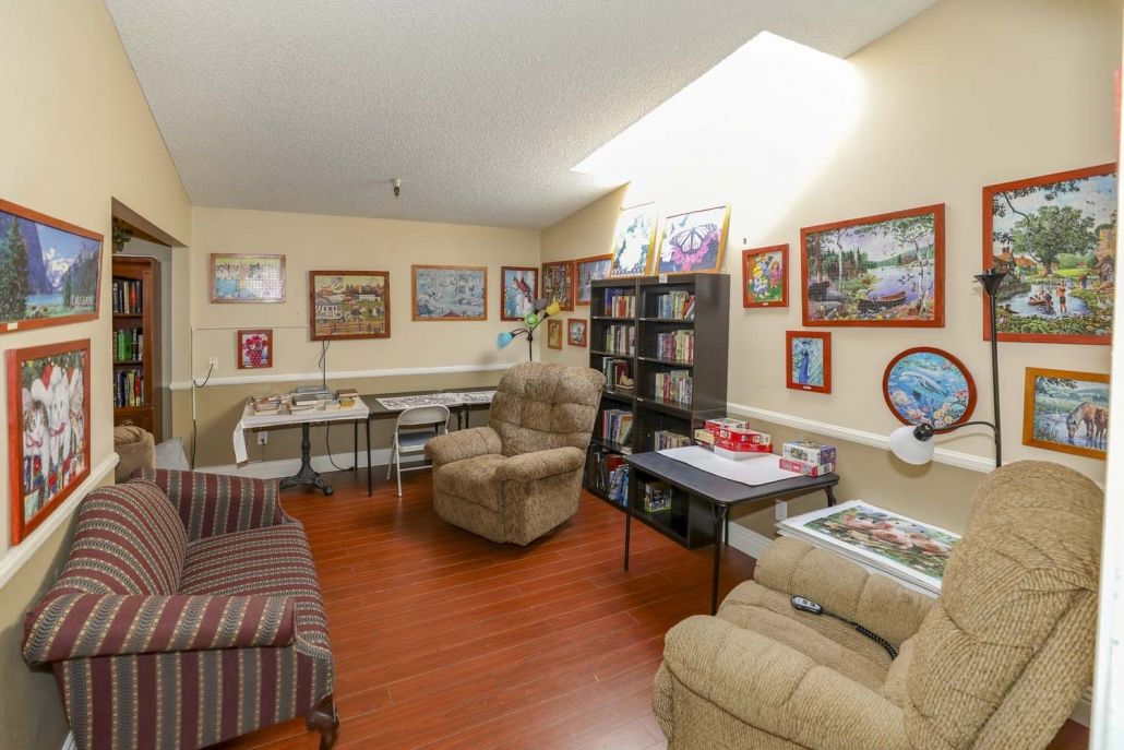 Cozy living room with comfortable seating and a collection of wall art.