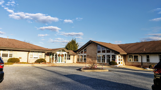 A modern architectural building set against a clear blue sky.