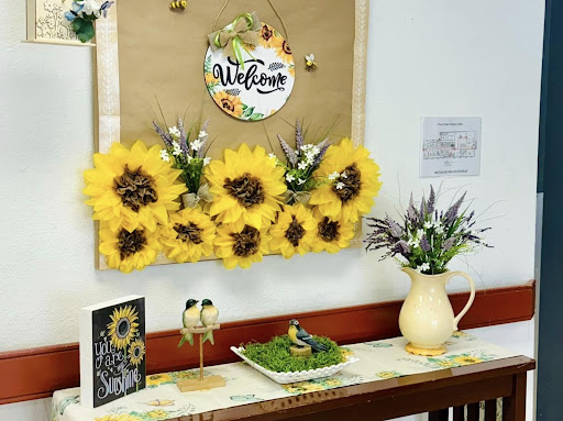 A vibrant and welcoming arrangement featuring sunflowers, enhancing the charm of a cozy space.