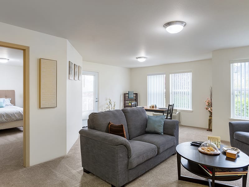 A modern living room with a cozy sofa and stylish decor.