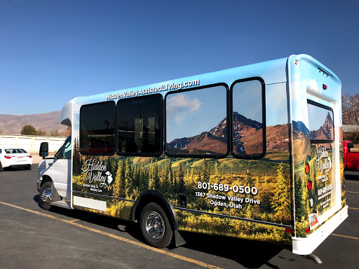A scenic bus featuring a beautiful mountain landscape.
