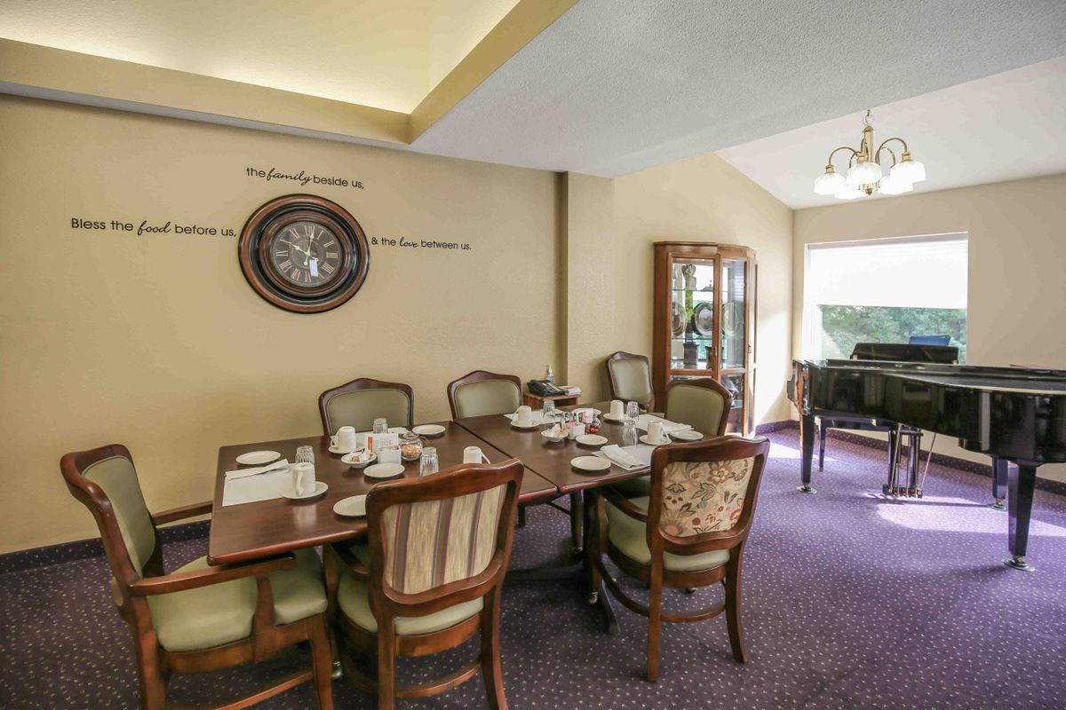 A well-appointed dining room with a set table and elegant decor.